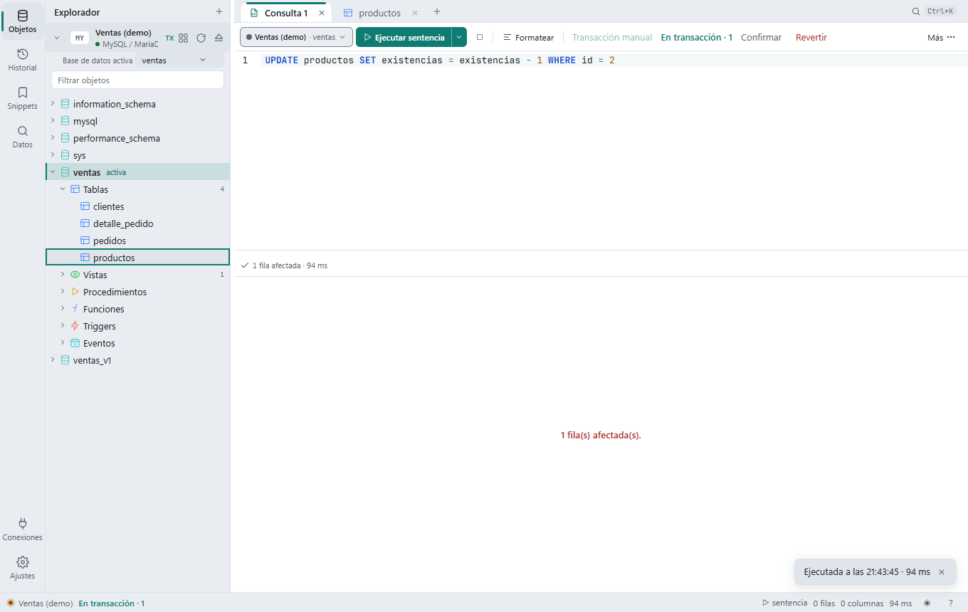 Editor en Transacción manual tras un UPDATE: la barra dice «En transacción · 1» con los botones Confirmar y Revertir, y la barra de estado lo repite